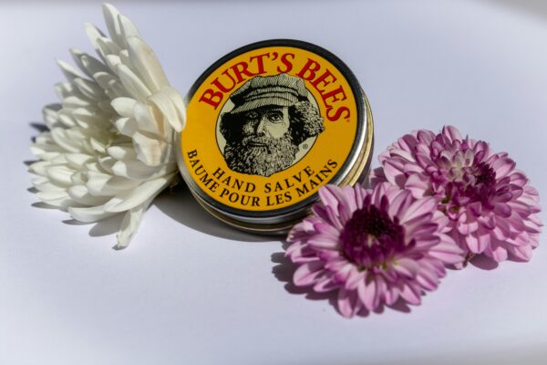 Box of Hand Cream among Flowers